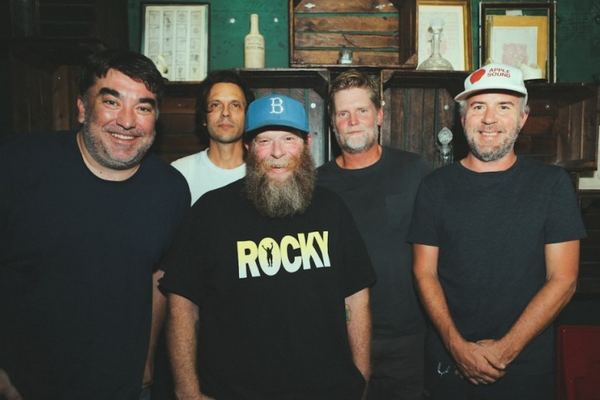 Grandaddy — five band members casually posed in a wood-panelled bar