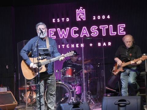 The Threads at Newcastle Kitchen + Bar, full band on stage under purple neon sign